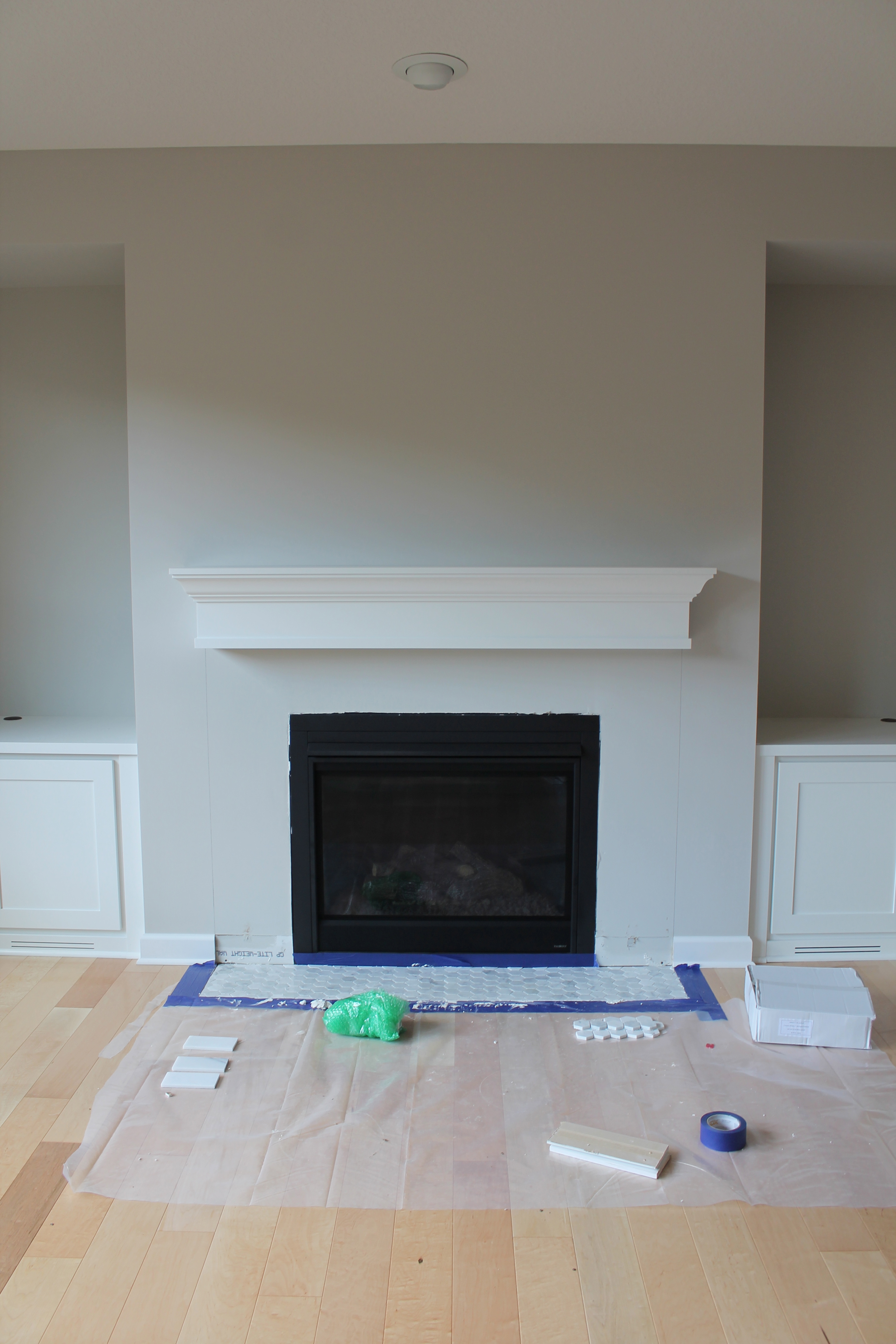 Marble tiles are a common way to add beauty to fireplaces. White is always a marketable and classic color. It is a bright color that reflects light and cleanliness. And marble is an ideal material for low traffic areas like fireplace surrounds. So this ti