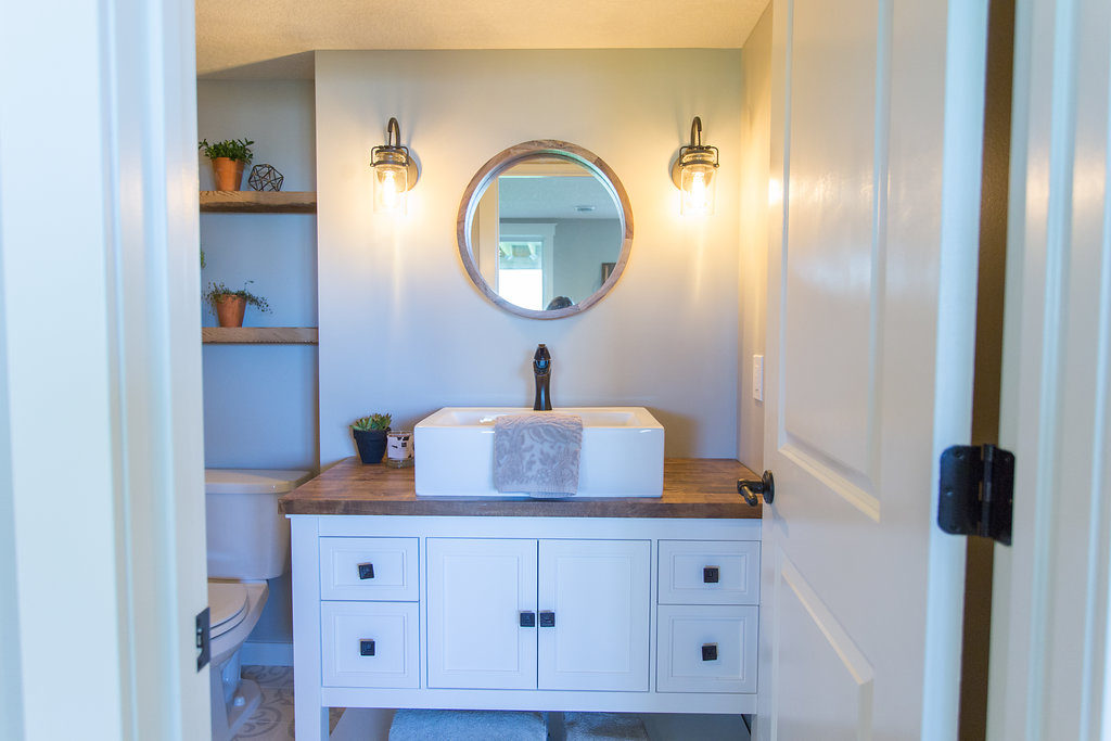 modern farmhouse bathroom with vessel sink and wood mirror | construction2style