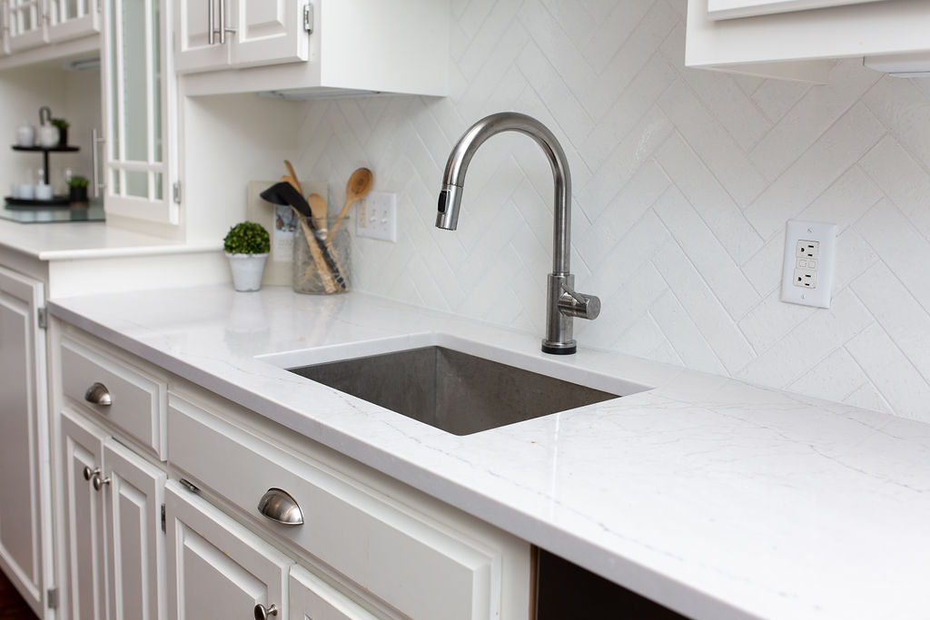white subway tile Classic Herringbone pattern in a white kitchen | construction2style