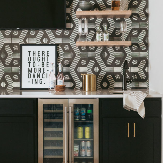 The Styled Press lower level reveal wet bar with zia tiles