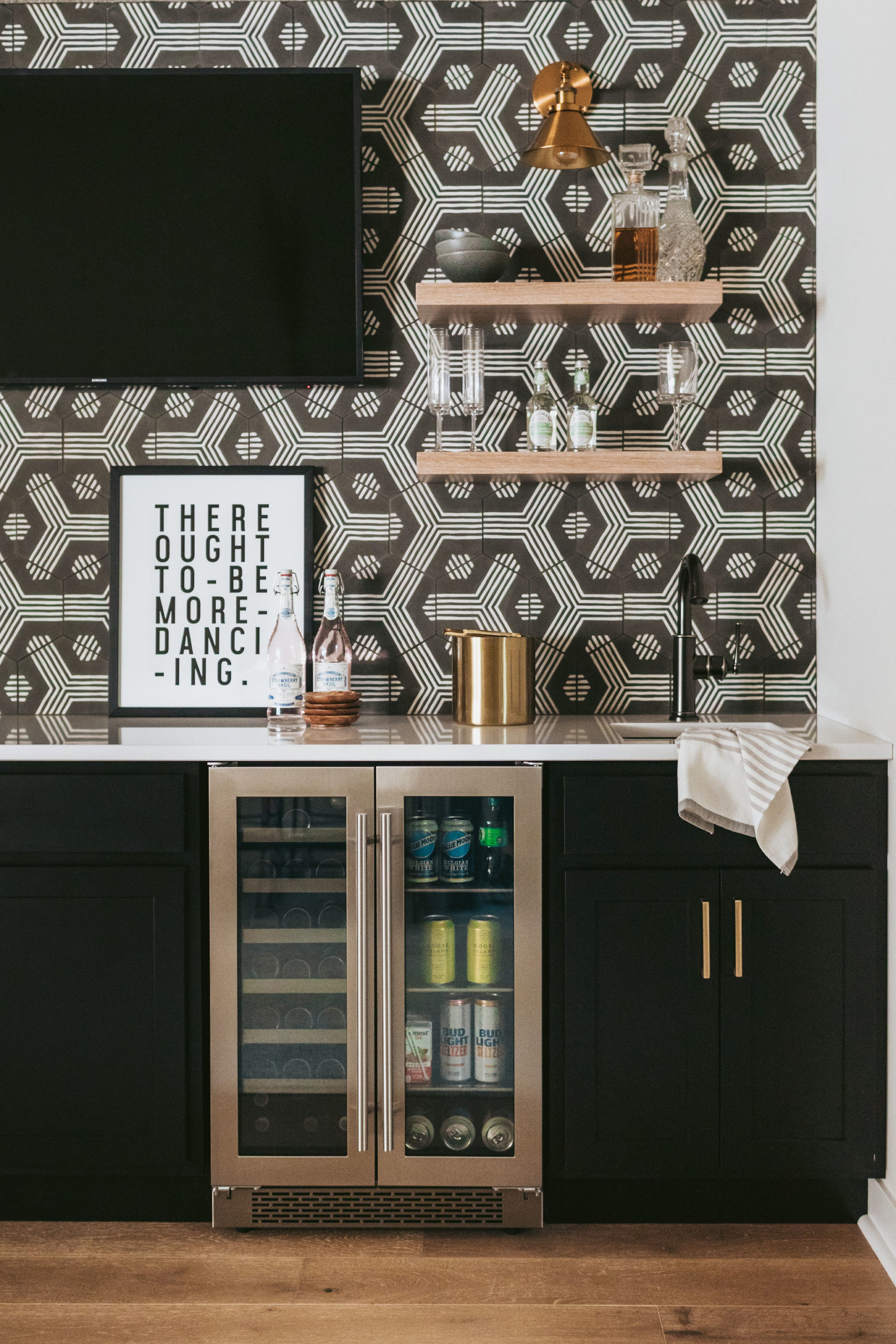 The Styled Press lower level reveal wet bar with zia tiles