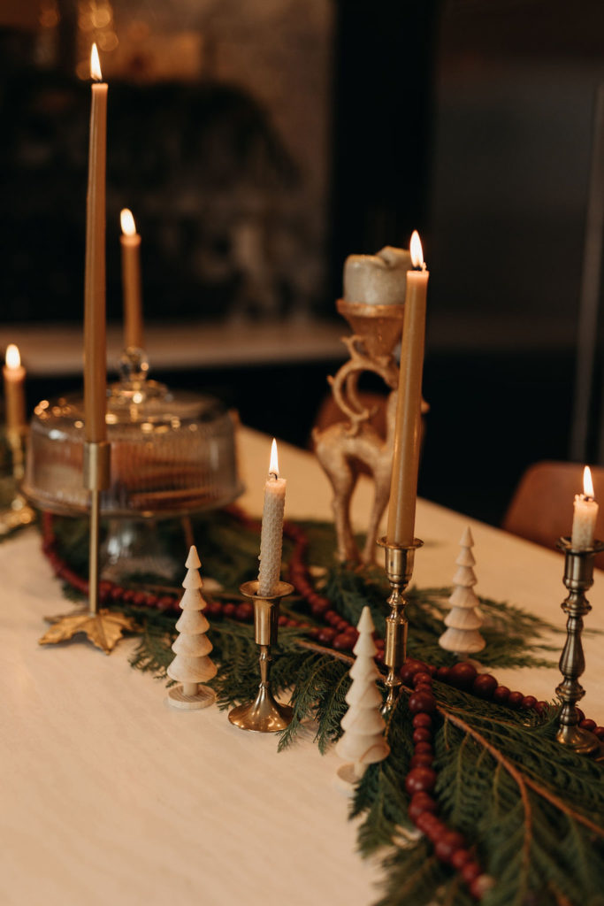 a table with candles and a candle holder