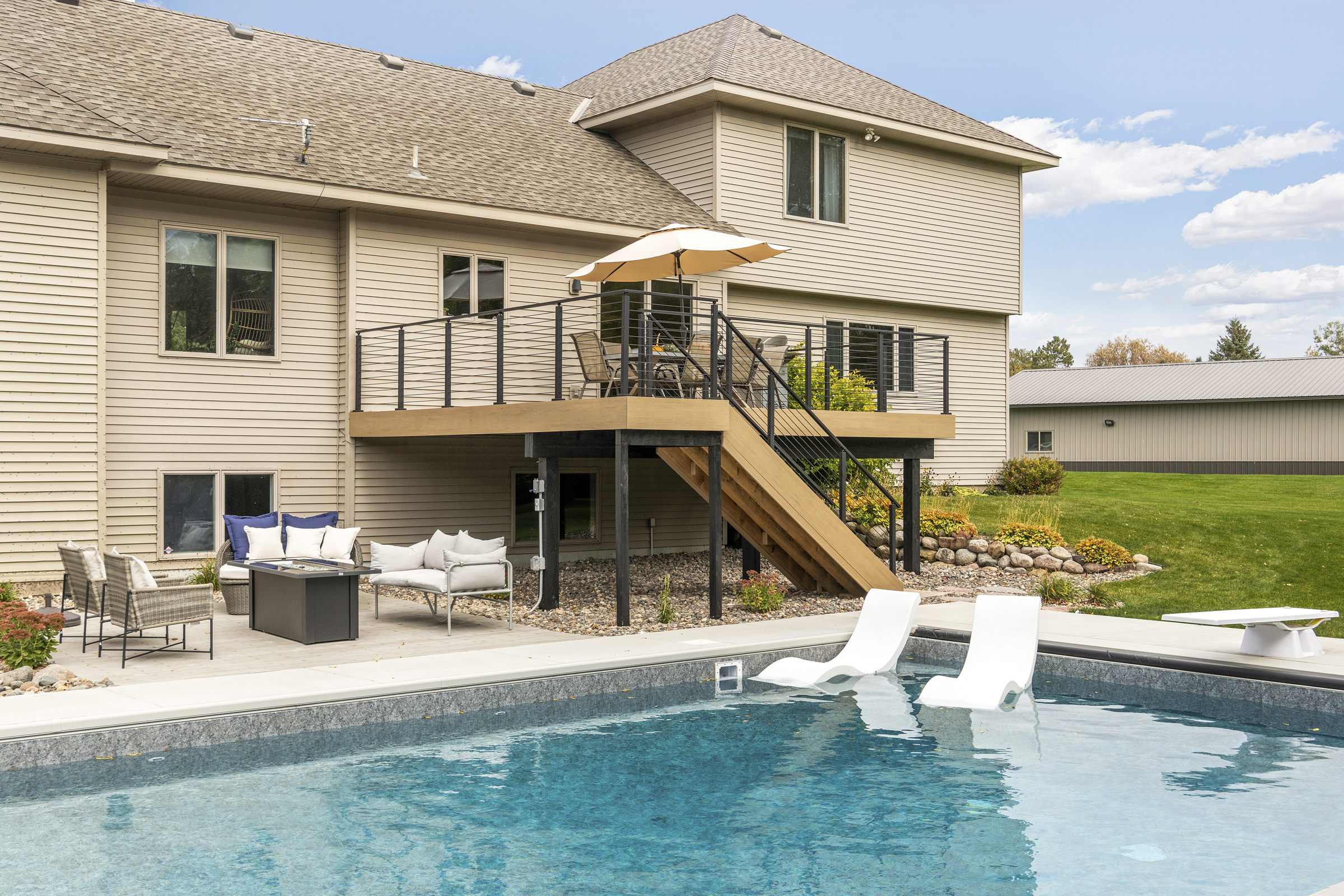composite decking material, black rod iron railing, viewrail, backyard pool design inspiration
