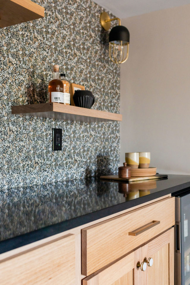 floating shelf from shelfology with decor as a part of a dry bar with custom lighting and wallpaper