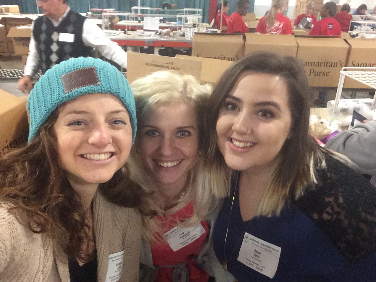 serving at feed my starving children with my girls