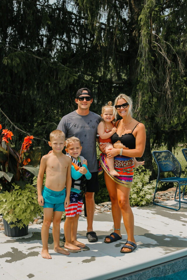 Flattering Swimsuits for moms | Jamie and Morgan Molitor with their three babies by the pool