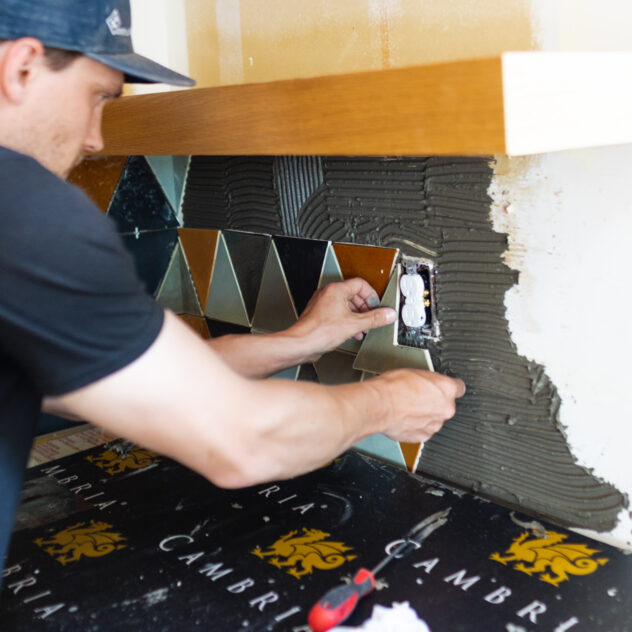 a man laying tile on the wall | 12 ways to lay subway tile