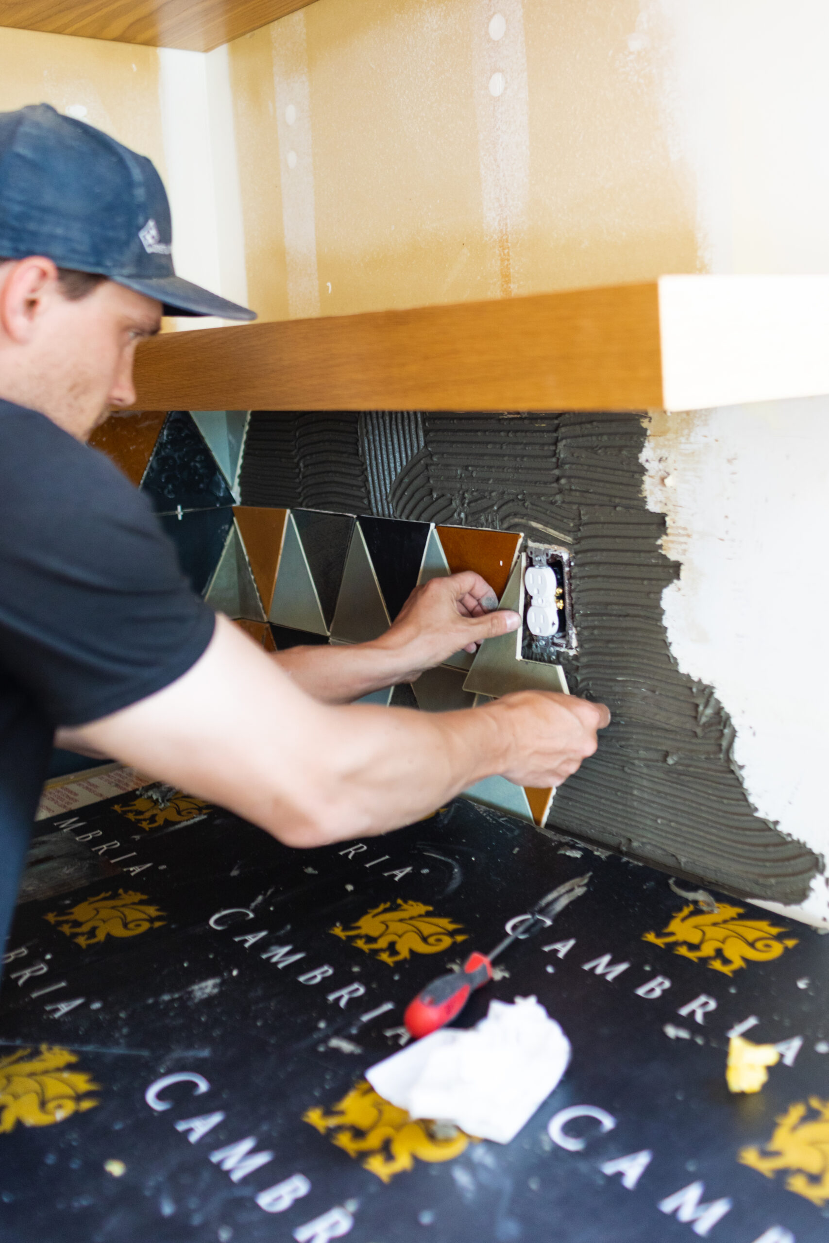 a man laying tile on the wall | 12 ways to lay subway tile