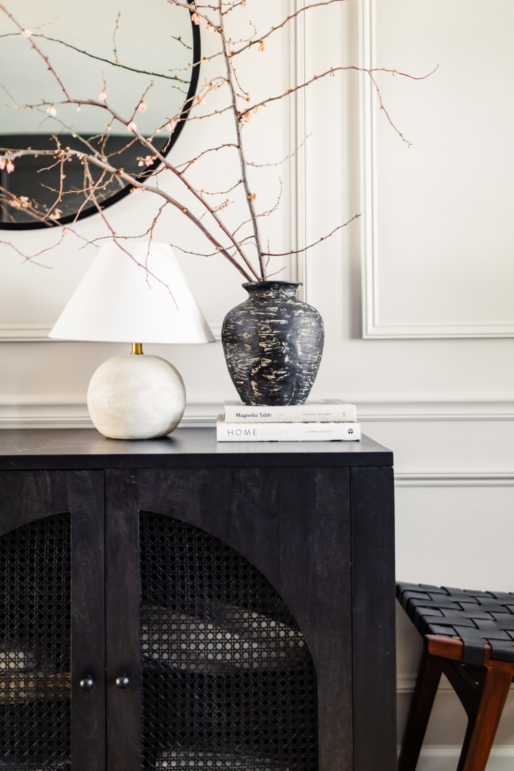 scandinavian minimalism | hallway with a woven chair, the vase with branches