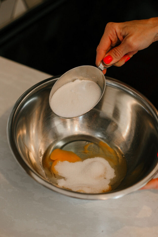 adding 3/4 cup granulated sugar to biscotti batter