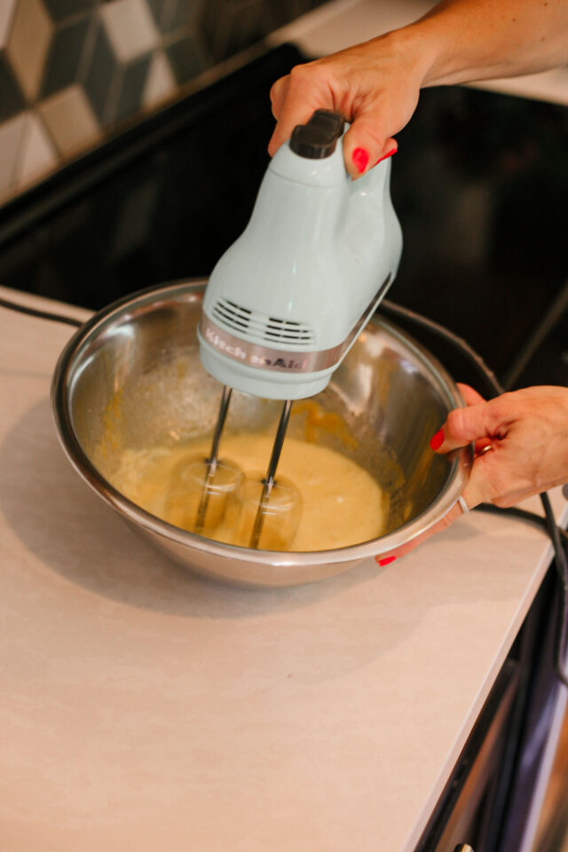 beating eggs and sugar until foamy and thick as a first step in baking Original Cantucci