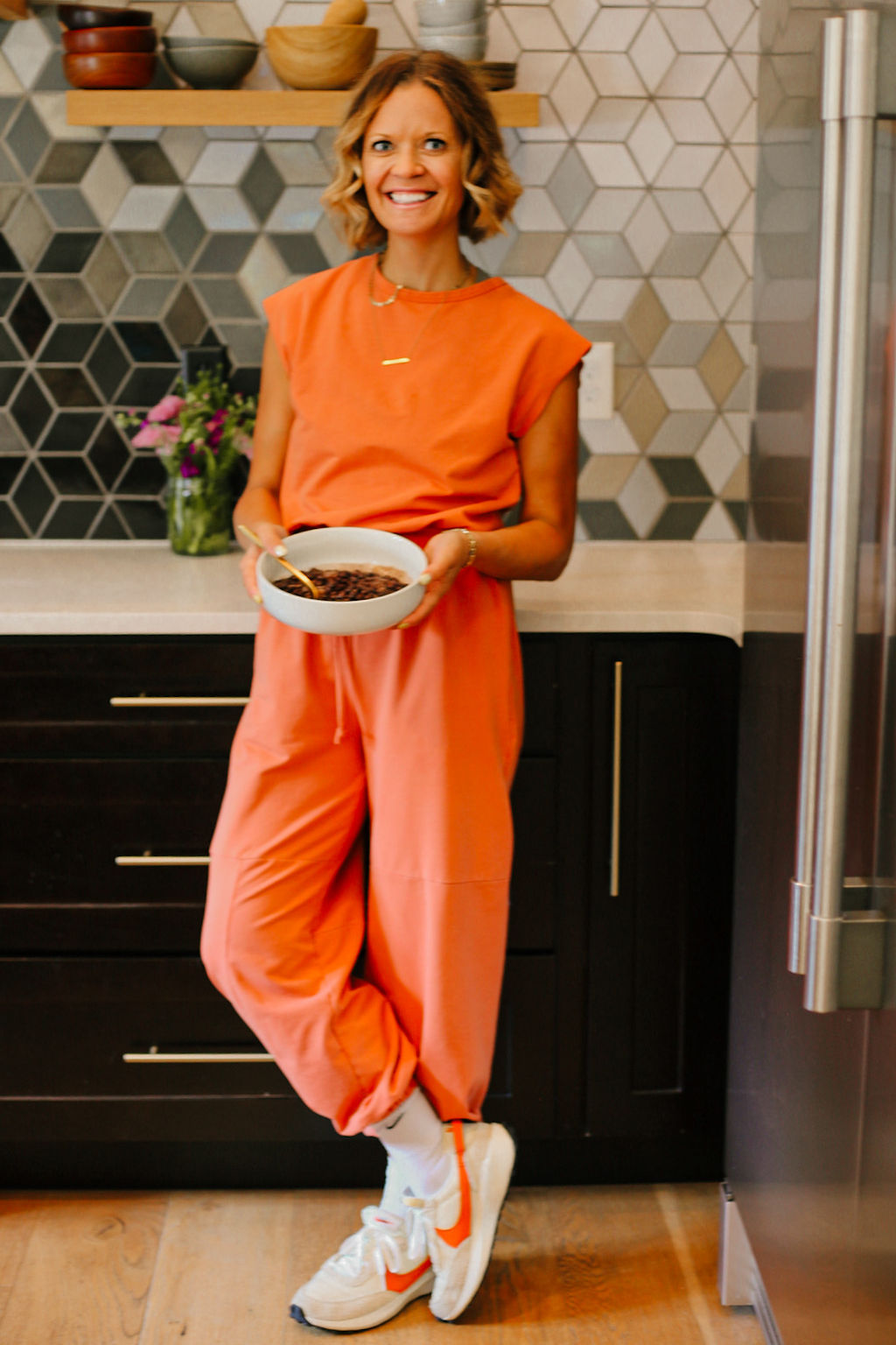 Morgan Molitor, c2s is holding a bowl of black beans, ready to serve.