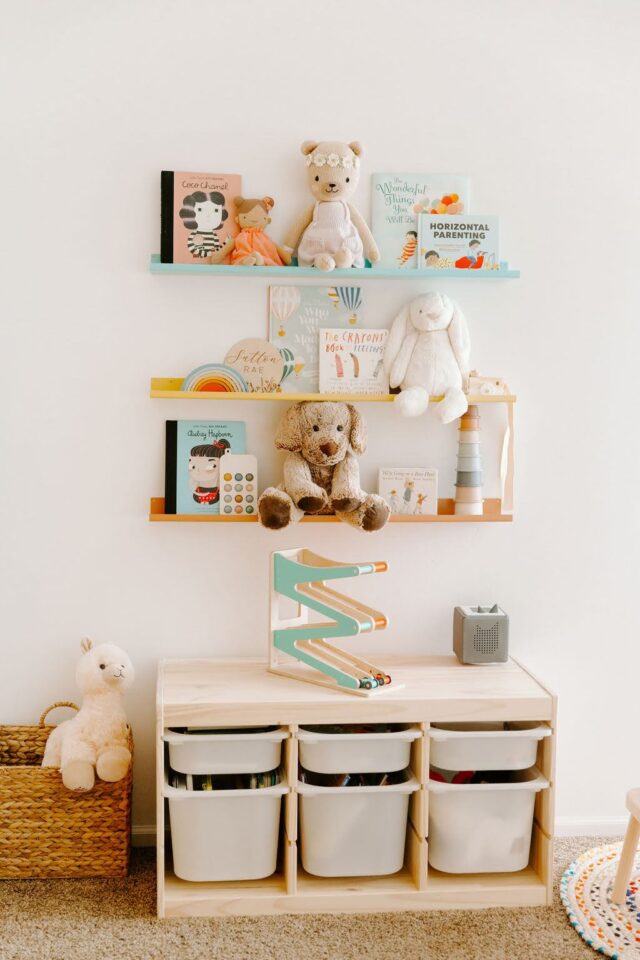 Toniebox is displayed on top of the 3 compartment montessori shelf in a toddler room; great Gift for Toddler Girl or toddler boy