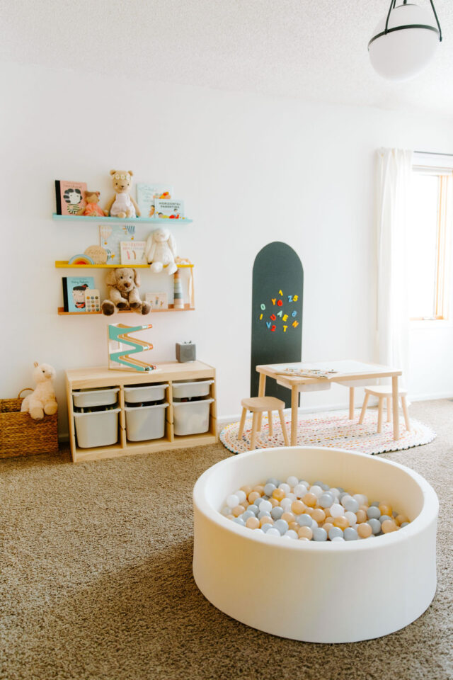 a beautiful shot of a toddler bedroom with a toniebox on IKEA storage combination with boxes