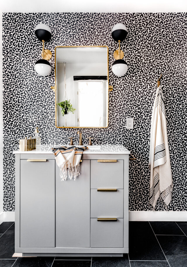 2025 bold black and white cheetah wallpaper in a guest bathroom designed by construction2style