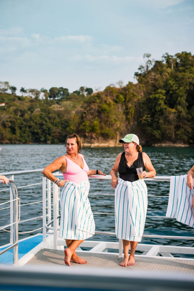 female contractors are chatting on the sundeck of the yacht in costa rica 