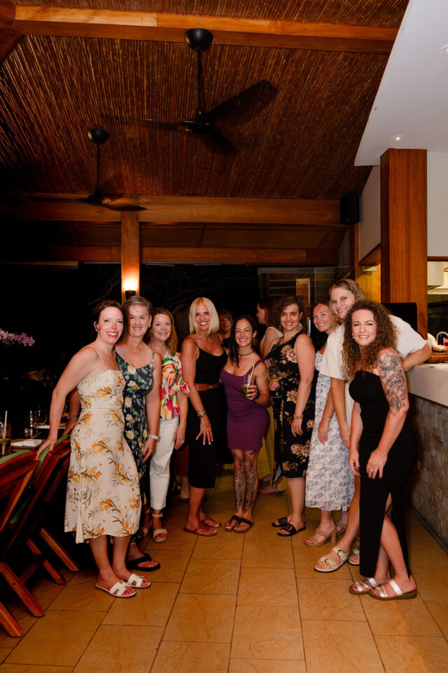 a photo of seven female builders with Meg Billings of Meg & Co and Allysin Case Anderson of integro builders who are about to have dinner at buildher retreat in costa rica 