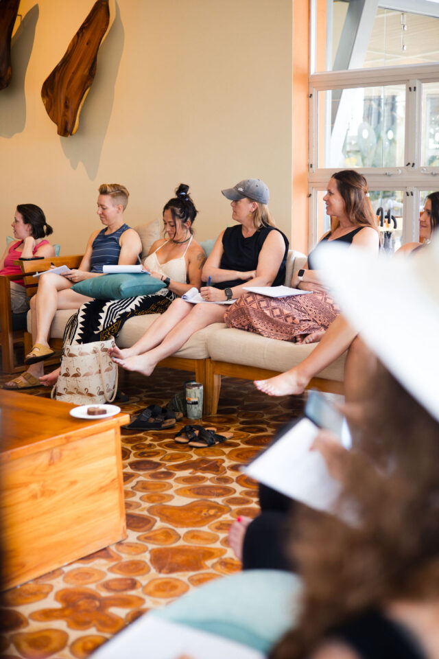 female contractors are listing to a presentation by Meghan Billings of Meg & Co at buildher retreat in 2025 in costa rica