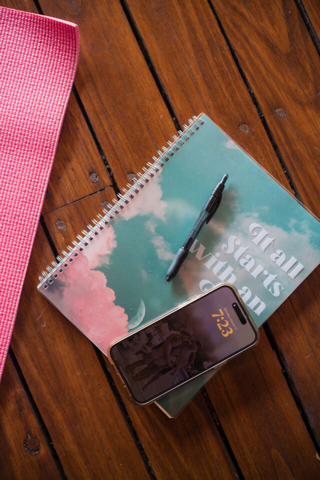 a photo of a notepad and a phone 