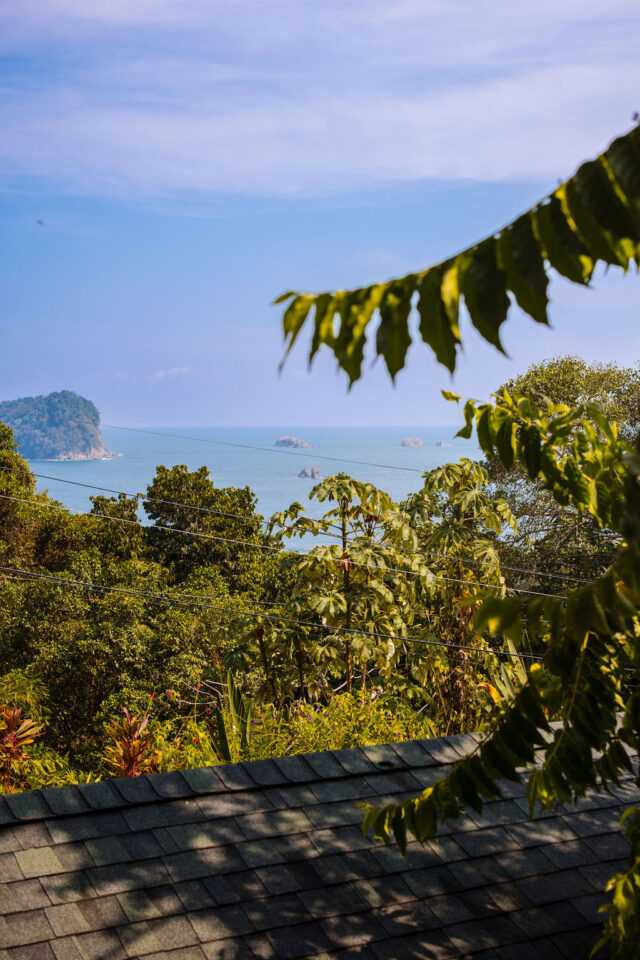 a beautiful photo of the ocean and cliffs from a balcony of the villa in costa rica | buildher retreat 2025