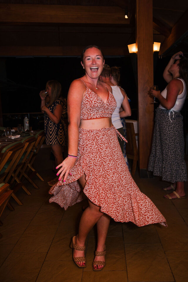 a photo of a female contractor dancing at buildher retreat 2025 in costa rica