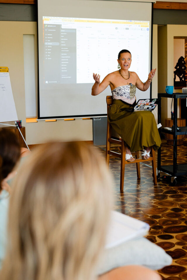 a photo of a surprised smile from Morgan Molitor of construction2style who is presenting at contractor conference for women, annual event held in costa rica