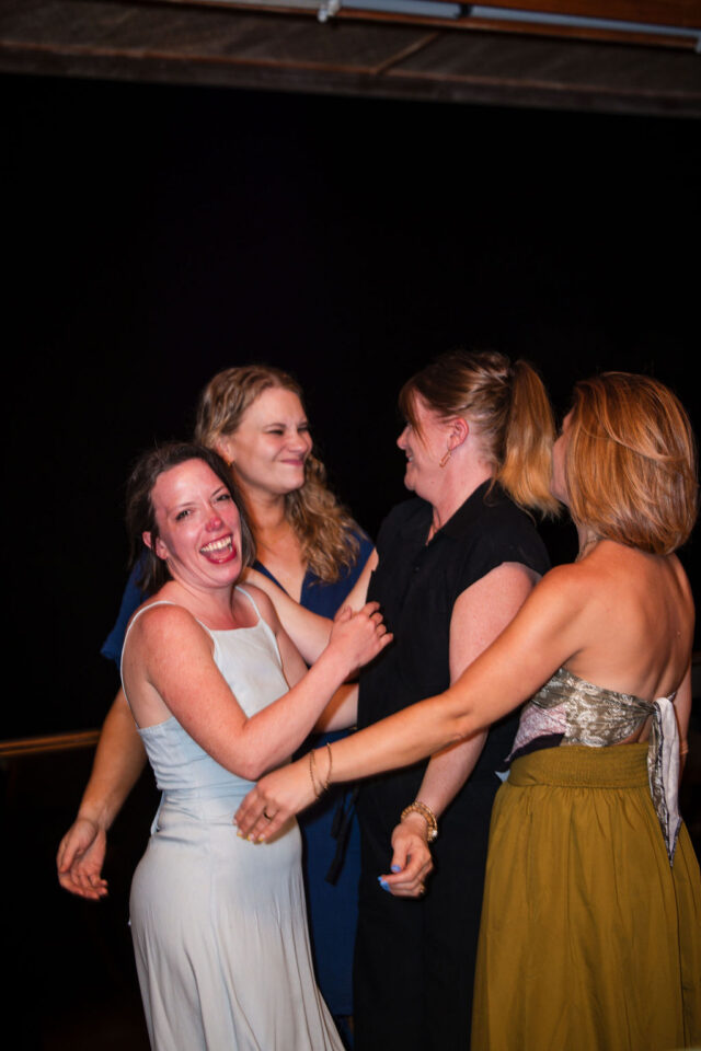 a photo of female contractors laughing after dinner in costa rica, attending a contractor conference for women, March 2025 