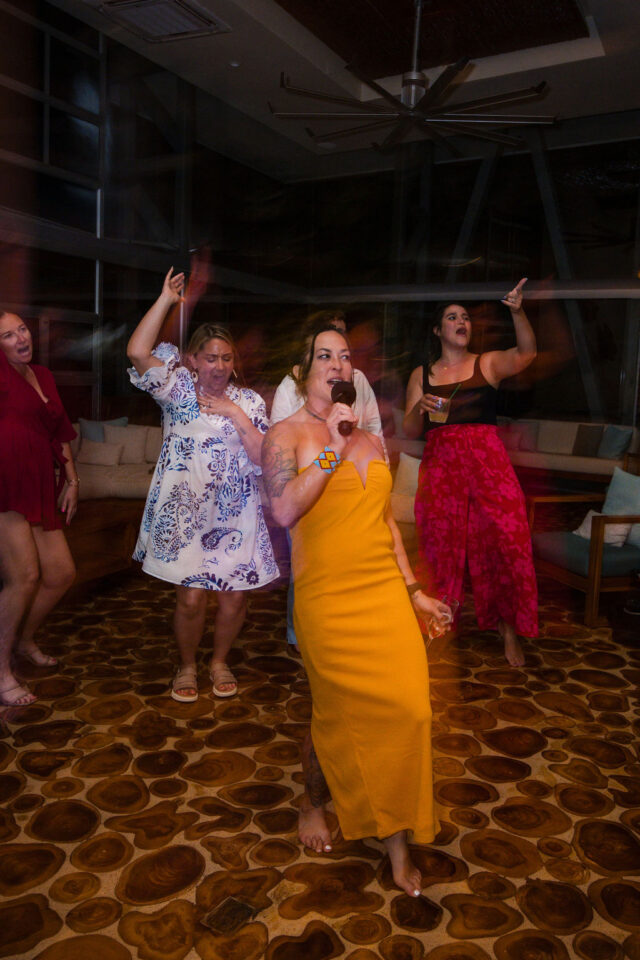 female contractors, singing karaoke and dancing together after dinner at contractor conference for women, called buildher 2025 held annually in costa rica