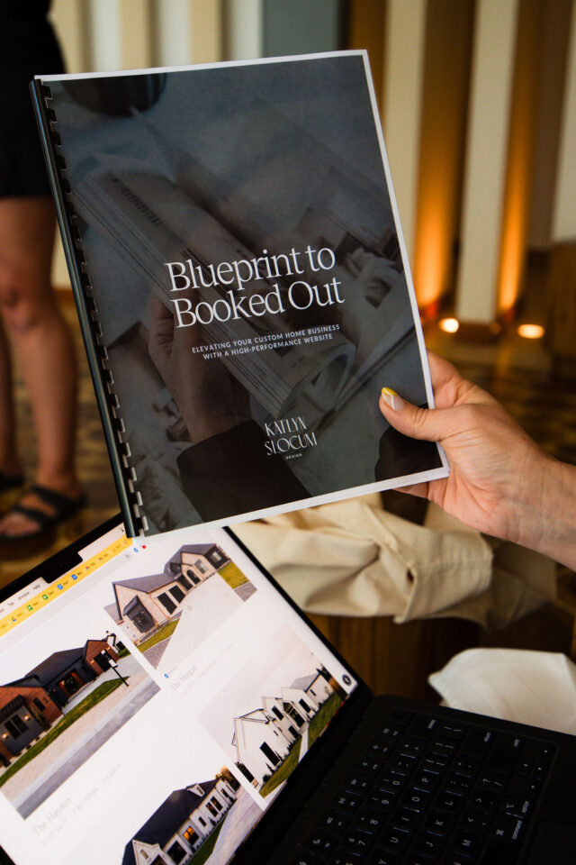 a photo of a laptop opened to a main page of Meg & Co website and a bound booklet by Kaytlin Slocum 