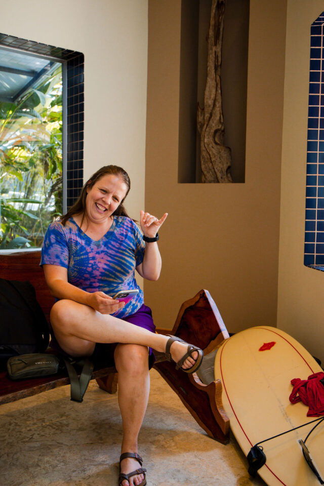 a photo of Betsy Littrell, a licensed architect and realtor from Nashville, TN who is getting ready to go surfing | buildher retreat in 2025 