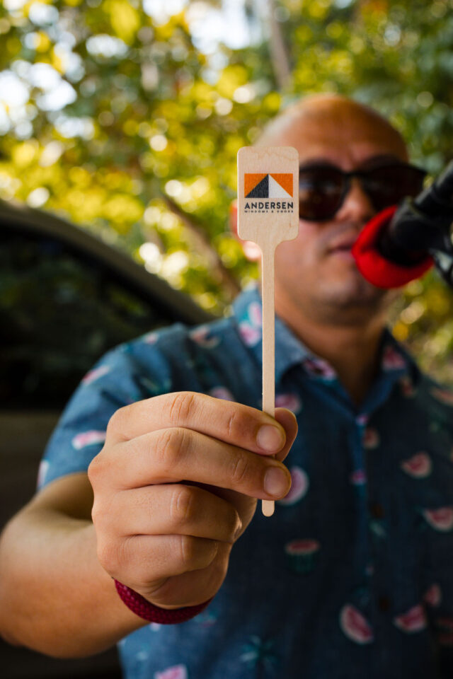 a man holding some andersen windows promotional materials in Costa Rica