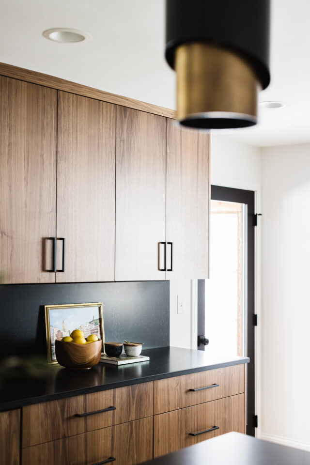 moody dark and dramatic kitchen with black hardware and black countertop is a true future of interior design and is one of the 2025 interior design trends you can incorporate in your home 