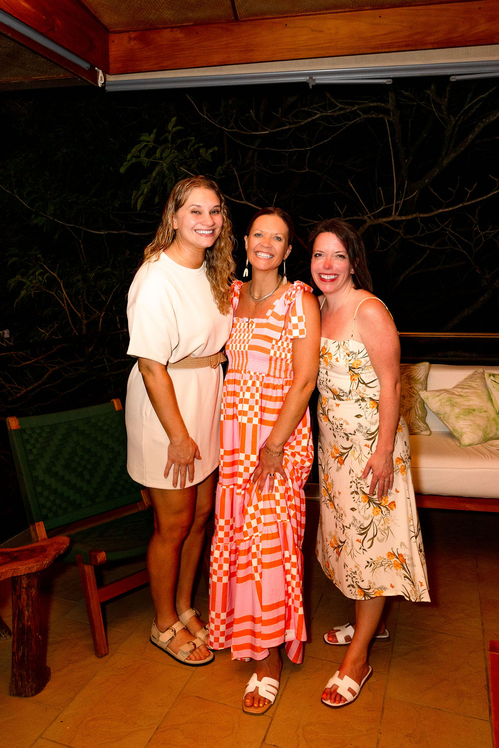A photo of Morgan Molitor from construction2style, Meghan Billings from Meg & Co, and Allyson Case Anderson from Integro Builders right after dinner attending a retreat for women in Costa Rica in March of 2025