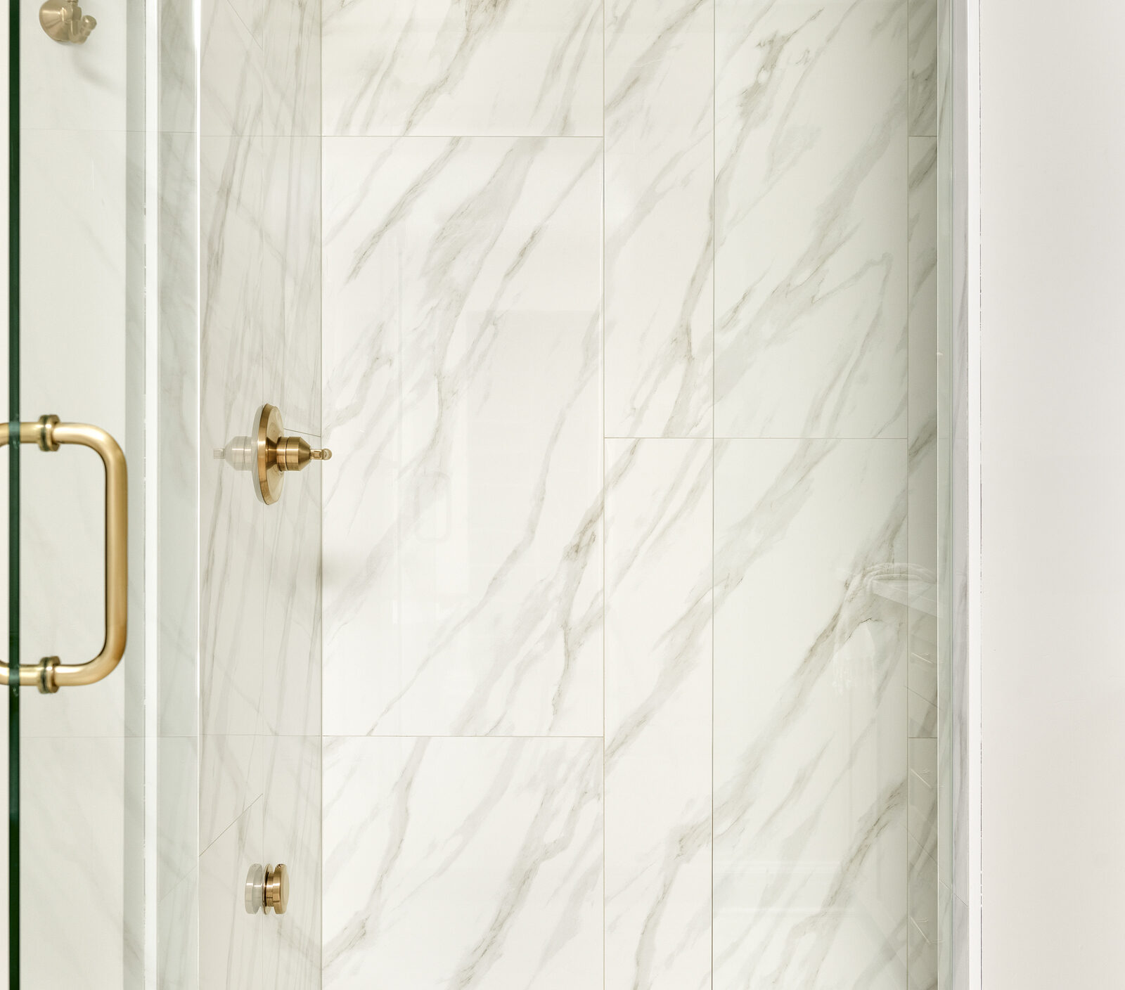 a photo in the shower in custom bathroom designed by construction2style, featuring VARA RIBIA PL 24X47 from emser tile on walls and VARA RIBIA MT 3