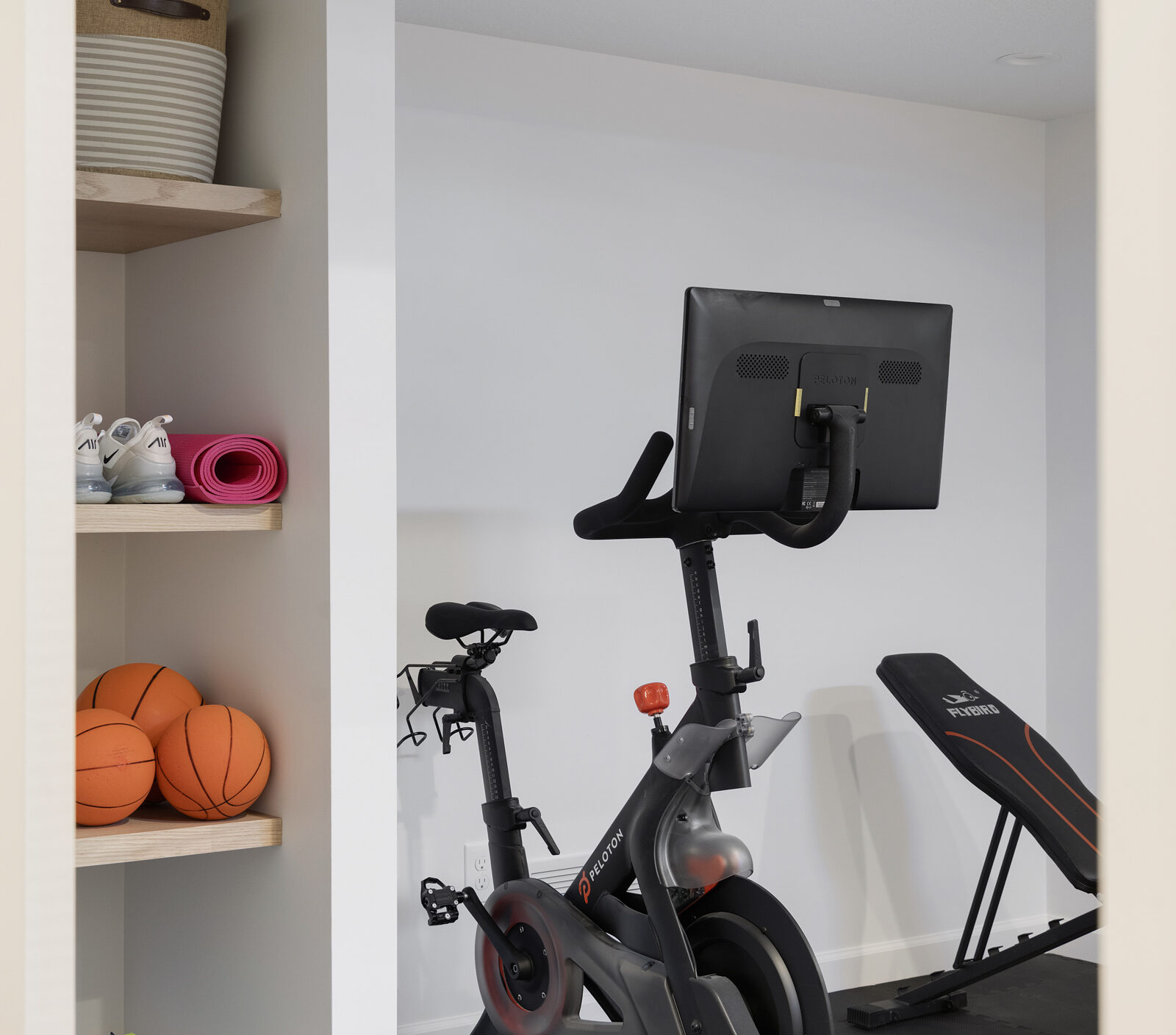 a photo of a gym in the lower level of a custom project | construction2style